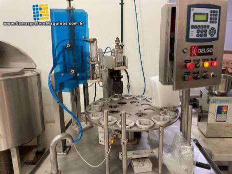 Seladora rotativa com selo de alum�nio para potes, copos e frascos Delgo